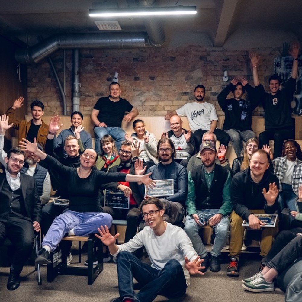 Group holding award plaques at the hackathon closing, Double9
