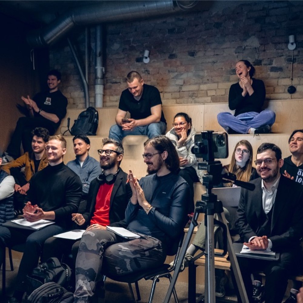 Audience applauding during a live pitch at Double9